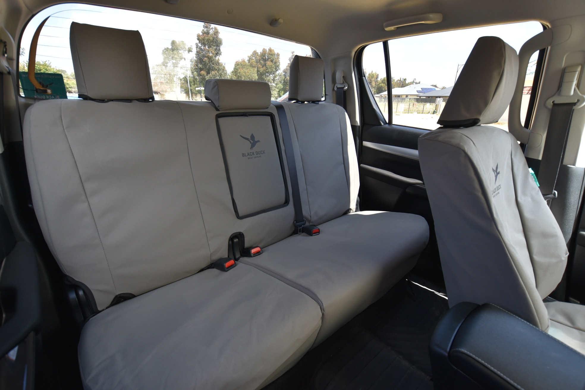 Image shows rear bench seat with 60/40 split base and fold down armrest in Grey Canvas.