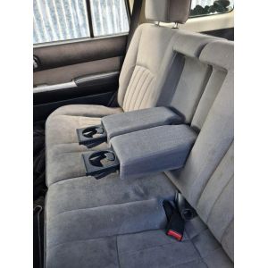 Black Duck® SeatCovers Row Two Rear Bench 50/50 split with Armrest Cover Nissan Patrol WAGONS from 10/2004 -04/2016.  NOTE THE POSITION OF THE CUP HOLDERS.