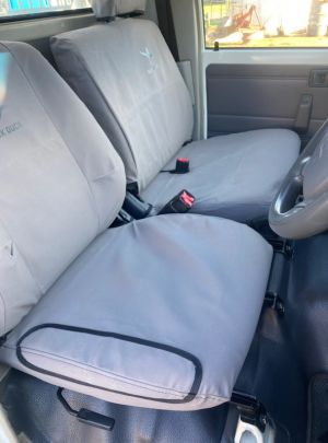 Driver Bucket & Passenger 3/4 Bench (3 seater) suitable for  VDJ79 Landcruiser Workmate & GX - From 08/2009+, Black Duck Seat Covers.
SHOWS AN OPTIONAL REINFORCING PATCH ON THE DRIVERS SEAT